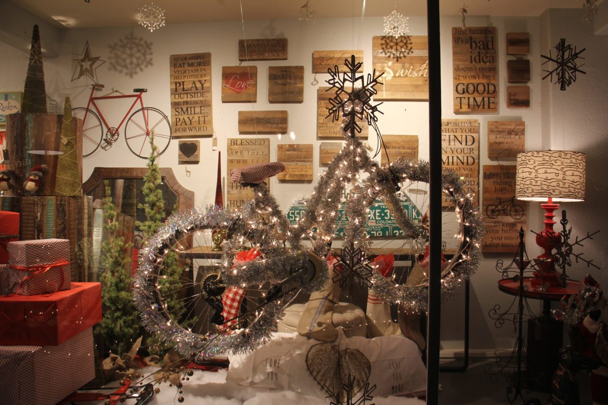 A holiday-decorated bike in a downtown Durango shop window during Noel Night